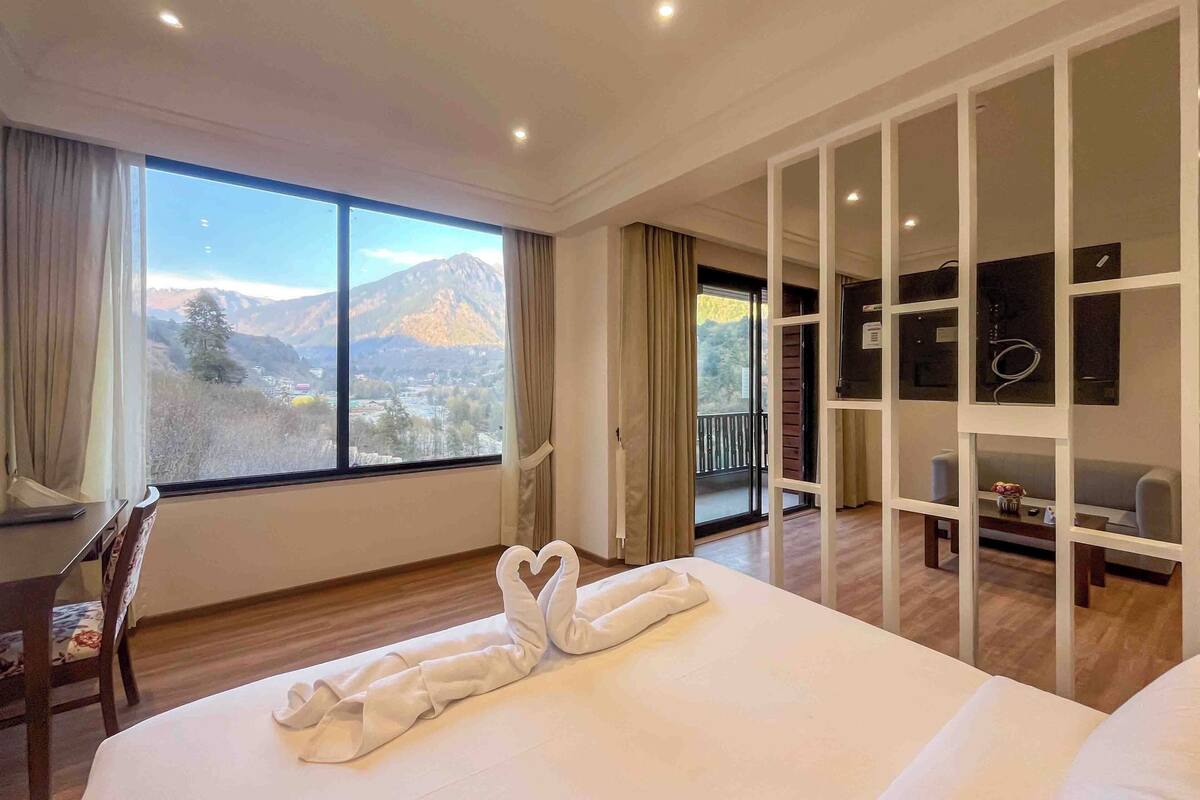 Deluxe Suite, Balcony, Mountain View | Desk, laptop workspace, soundproofing, iron/ironing board (on request)