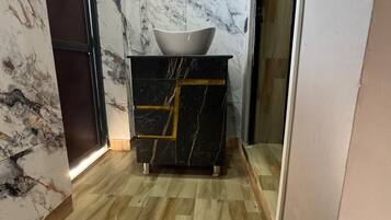 Deluxe Room, Hill View | Bathroom | Shower, towels, soap, toilet paper