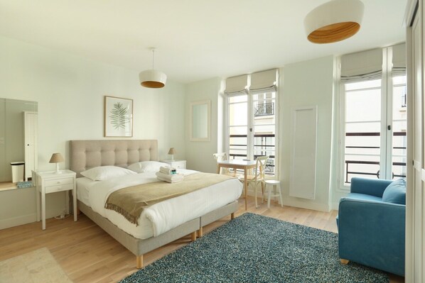 Apartment | Laptop workspace, iron/ironing board, bed sheets