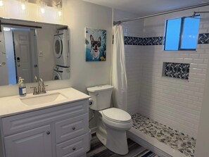 Shower, hair dryer, towels