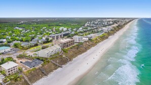 An aerial view of a coastal residential area with beachfront properties and a sandy beach. - BRAND NEW CONSTRUCTION! CLOSE TO BEACH!  PET FRIENDLY! 3/2 SLEEPS 6! (Panama City Beach)