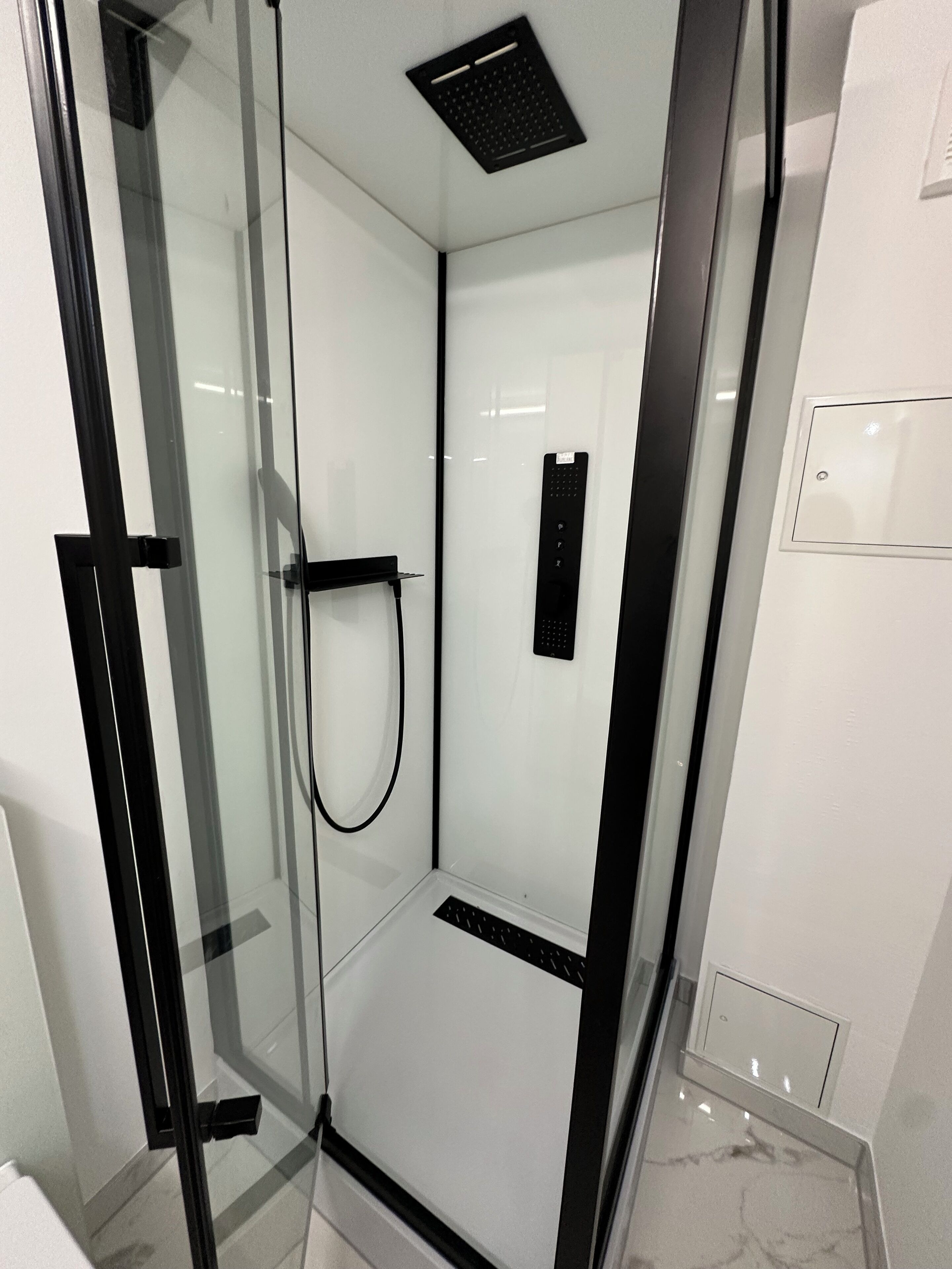 Shower, towels, soap, toilet paper
