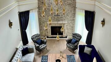 Deluxe Villa, Private Pool, Garden View | Living area | Fireplace