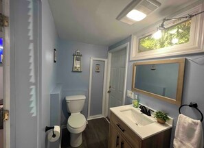 Shower, hair dryer, towels, toilet paper