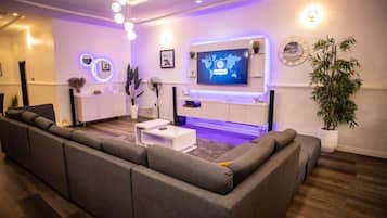 Family Apartment, Balcony, City View | Living area | Flat-screen TV