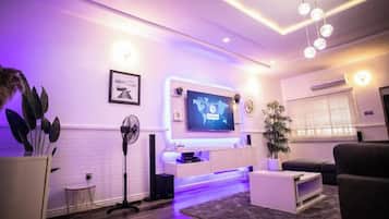 Family Apartment, Balcony, City View | Living area | Flat-screen TV