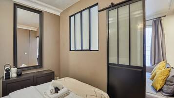 Apartment | Laptop workspace, iron/ironing board, bed sheets