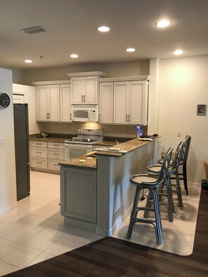 Microwave, stovetop, dishwasher, coffee/tea maker