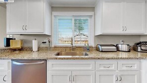 Private kitchen - Waterfront modern home Sleeps 6 near Marina w/ Hot Tub, Large Deck, and EVCharge (Discovery Bay)