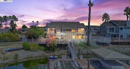 Waterfront modern home Sleeps 6 near Marina w/ Hot Tub, Large Deck, and EVCharge