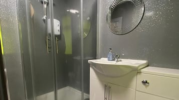 Shower, towels, toilet paper