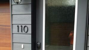 A front door with a number '110' and a keypad lock. - rent comfort in canmore - central to everything (Canmore)
