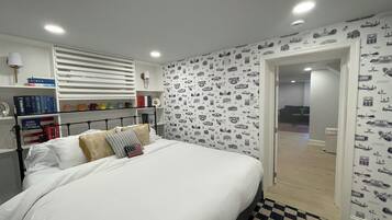 1 bedroom, desk, iron/ironing board, travel crib