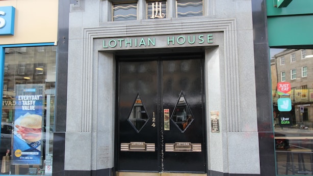 The entrance to Lothian House with double doors and a sign above.