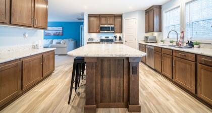 New Remodel on Black River with Hot Tub, Kayaks, Gym, Fireplace, & Game Room!