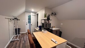 A compact kitchen with a wooden table, a microwave, and a sink. - Peaceful Woodland charm 12 minutes from Corbin/London, 18 minutes from I-75 (Lily)