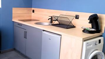 Fridge, microwave, coffee/tea maker, cookware/dishes/utensils