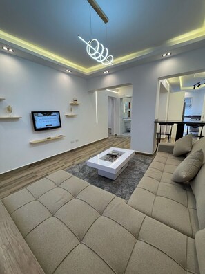 Luxury Apartment | Living room | 43-inch Smart TV with cable channels - Delta Sharm Resort - Sharm El-Sheikh (Sharm El Sheikh)