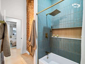 Shower, hair dryer, towels, shampoo