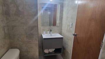 Bidet, towels, soap, toilet paper