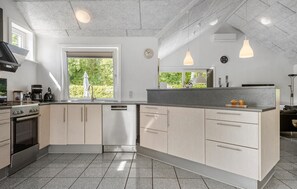 Fridge, stovetop, dishwasher, coffee/tea maker