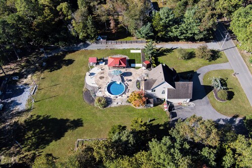 ClubDivot - A Modern Farm Style  Home with Pool and Backyard Bar