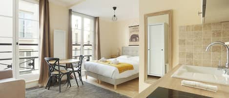 Apartment | Laptop workspace, iron/ironing board, bed sheets