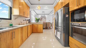 Family Condo, Garden View | Private kitchen | Fridge, microwave, oven, stovetop