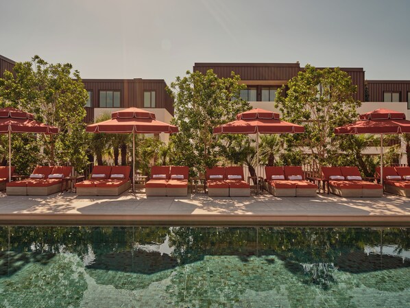 Outdoor pool, open 7:00 AM to 10:00 PM, free pool cabanas