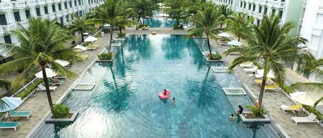 3 outdoor pools, open 7:00 AM to 7:00 PM, pool umbrellas, pool loungers