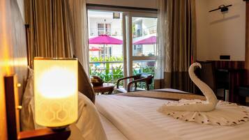 Premium Room, Pool View | Desk, laptop workspace, iron/ironing board, free WiFi
