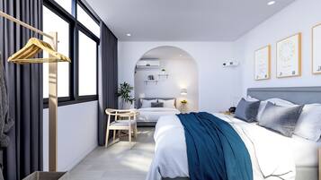A modern hotel room with a bed, a desk, and a chair. There is a window with curtains, a plant, and a lamp.