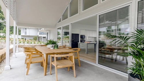 Resort style living with pool, tennis court and beach