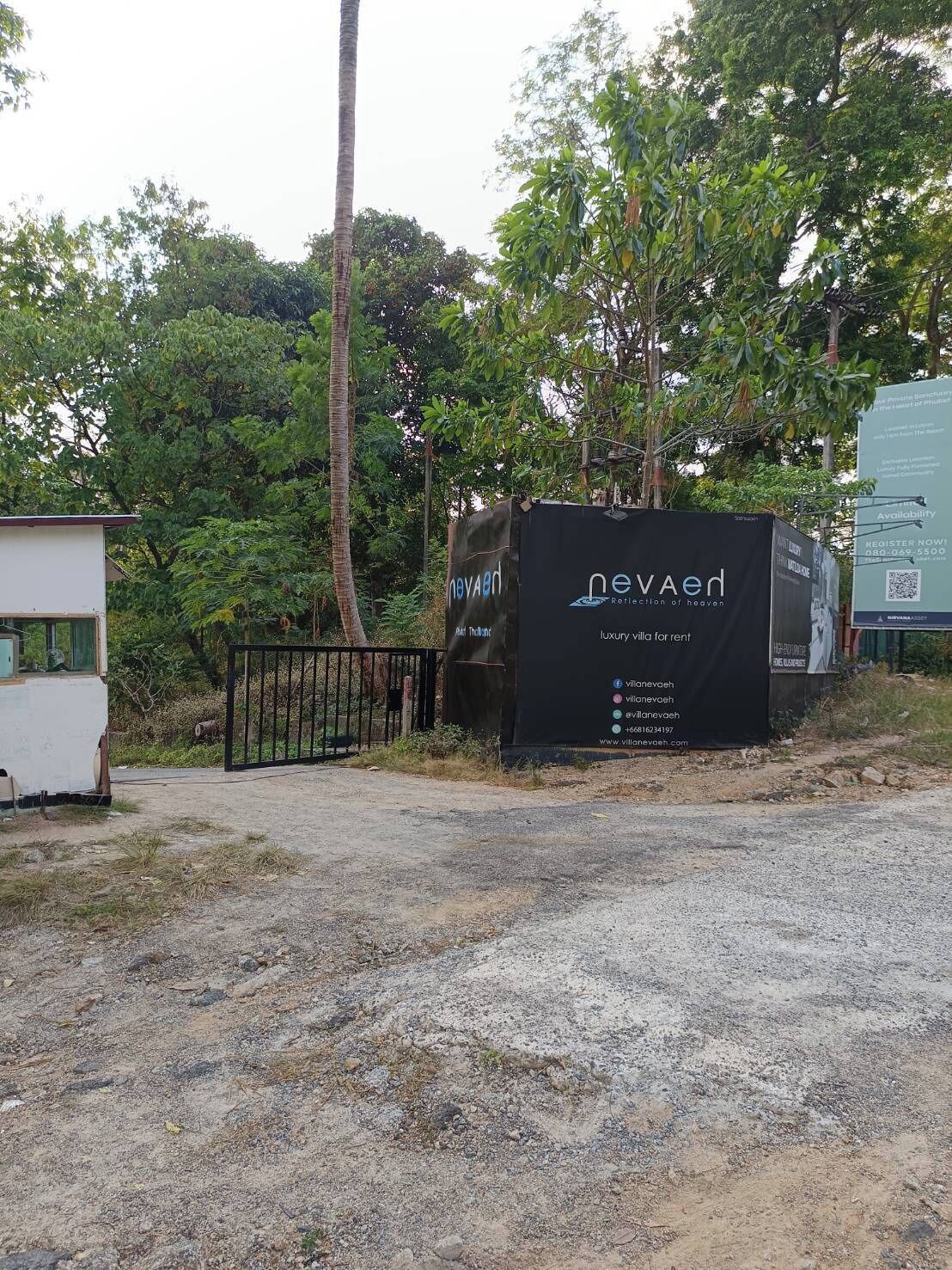 A signboard for 'nevaed' with contact information and a website URL.