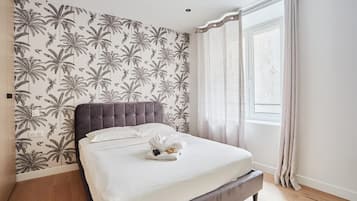 Apartment | Laptop workspace, iron/ironing board, bed sheets