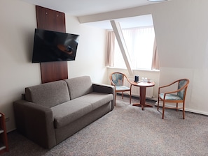 Premium Double Room | Living area | Flat-screen TV