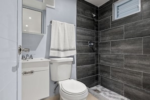 Shower, towels, soap, toilet paper