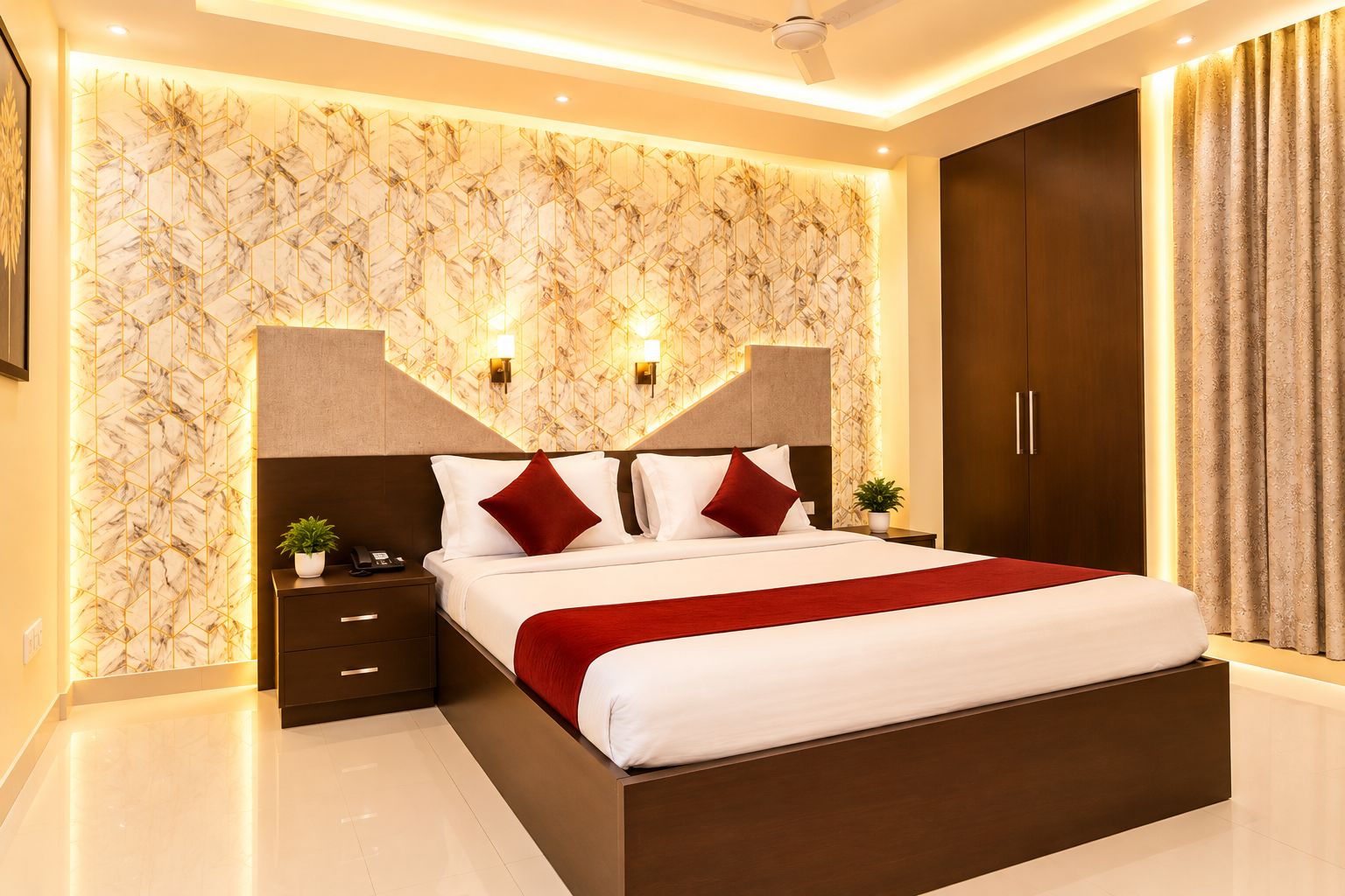 A modern hotel room with a marble-patterned wall, a large bed with red and white bedding, a nightstand with a phone, and a wardrobe.