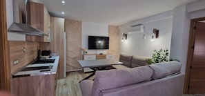 Apartamento Cazorla Natura 1 | Living area | 55-inch flat-screen TV with digital channels, streaming services - Cazorla Natura Apartamentos Turísticos (La Iruela)
