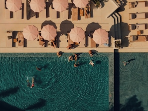 Indoor pool, outdoor pool, pool umbrellas, pool loungers