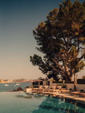 Indoor pool, outdoor pool, pool umbrellas, sun loungers