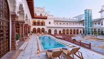 Outdoor pool, pool umbrellas, sun loungers