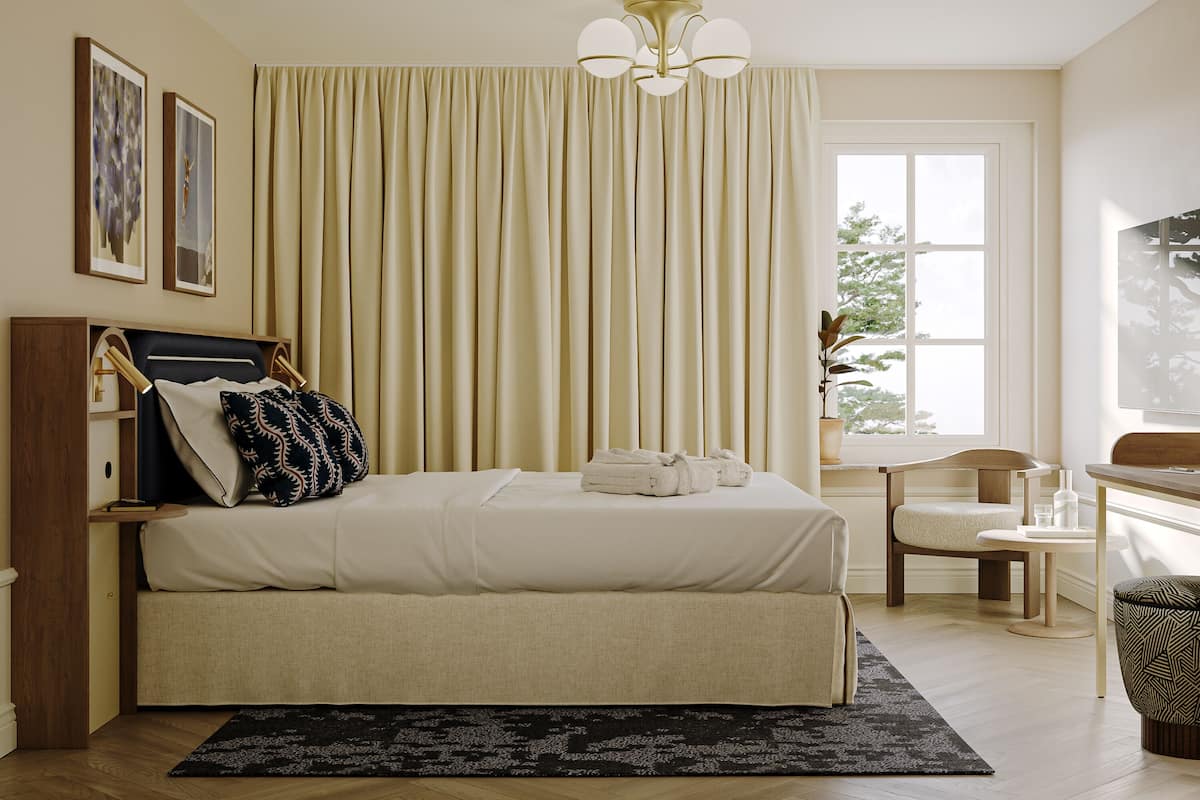 A bedroom with a bed, a chair, a desk, a window, and curtains.