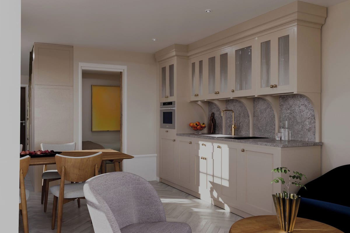 A modern kitchen with white cabinets, a granite countertop, and a built-in oven.