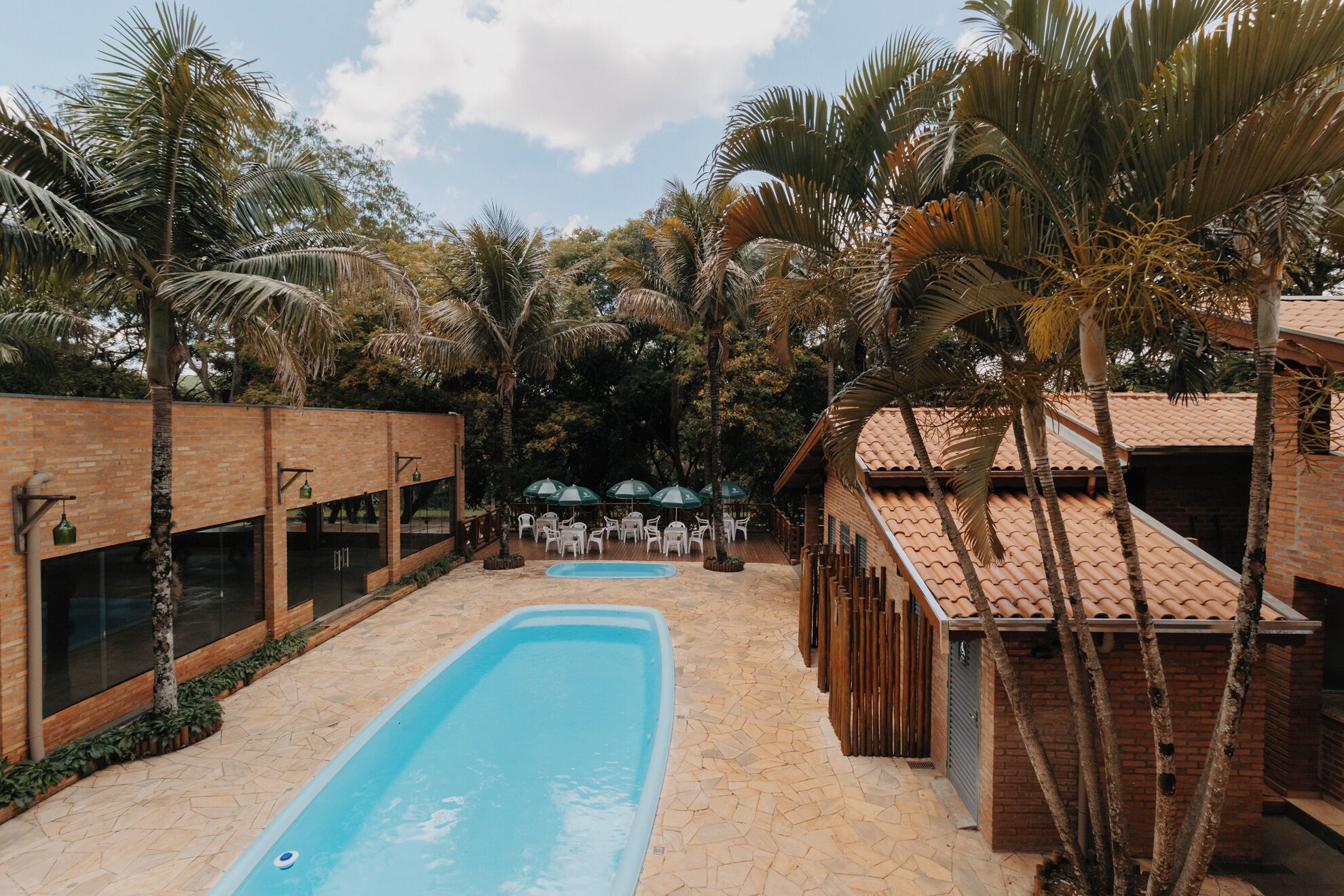 2 outdoor pools, open 9:30 AM to 10:30 PM, pool umbrellas