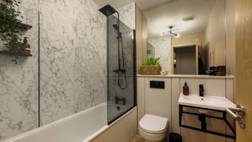 Shower, hair dryer, towels, soap