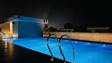 Outdoor pool, open 7:00 AM to 7:00 PM, free cabanas