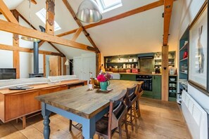 Enjoy cooking in this well-equipped kitchen with a large table and modern appliances.
