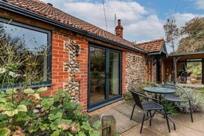 Enjoy a home away from home with a spacious interior and patio area.