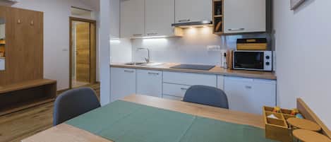 Classic Apartment | Private kitchen | Fridge, electric kettle, dining tables